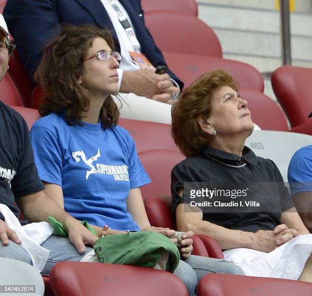 The adoptive family of Mario Balotelli, sister Cristina Balotelli and mother Silvia Balotelli look on during the UEFA EURO 2012 semi final match...