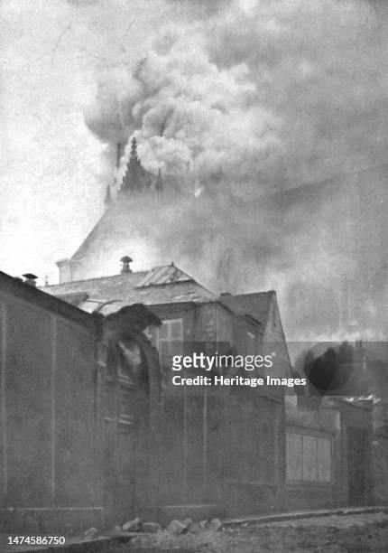 ''Le Cathedrale de Reims en flammes; Le clocher a l'Ange et la toiture du chevet en feu', 1914. From "L'Album de la Guerre 1914-1919: Volume I"....