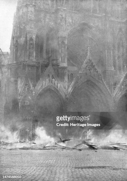 'Le Cathedrale de Reims en flammes; La chute de l'echafaudage embrase de la tour Nord-Ouest', 1914. From "L'Album de la Guerre 1914-1919: Volume I"....