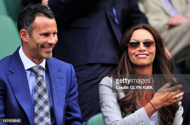Wales and Manchester United footballer Ryan Giggs and his wife Stacey Cooke in the Royal Box before play on day six of the 2012 Wimbledon...