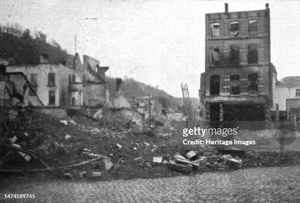 Dinant; au coeur de la ville, un enchevetrement de pierres et de cendres, decombres qui recouvrent des ossements humains', 1914. From "L'Album de la...