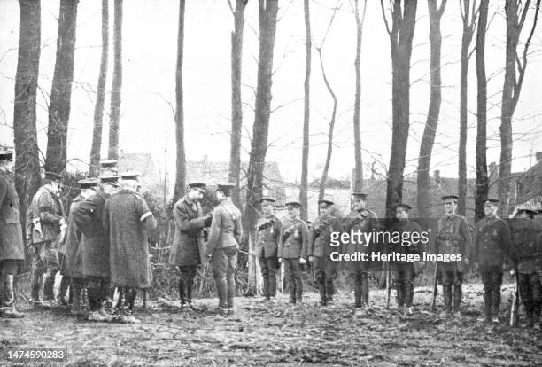 Honneur; Le roi George V. Decore des soldats anglais de la medaille enviee du "Distinguished service order" ', 1914. From "L'Album de la Guerre...