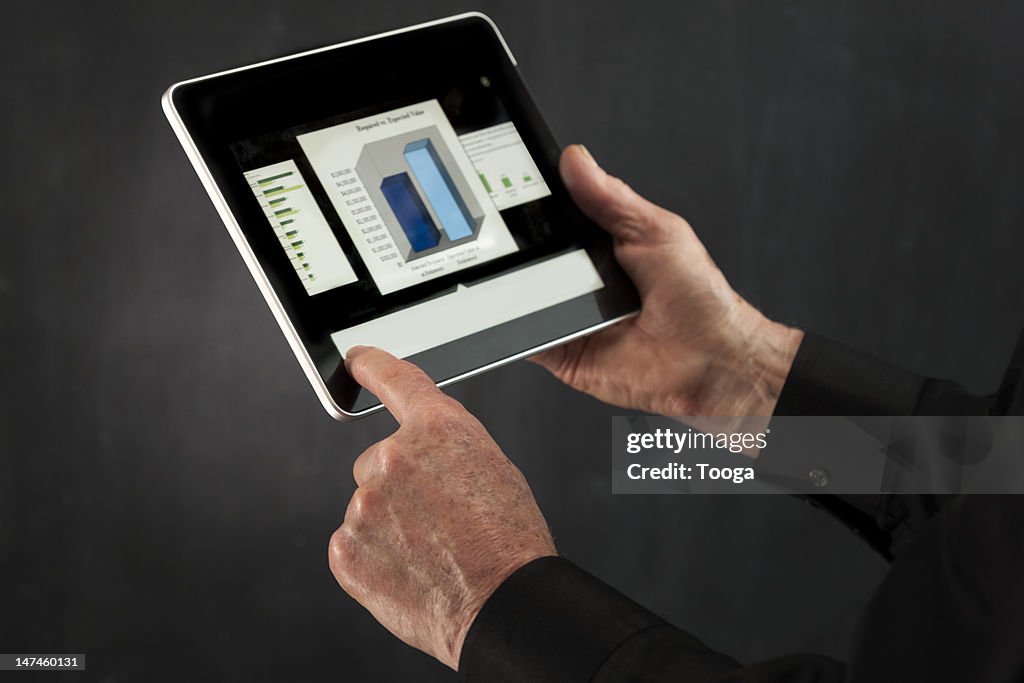Male hands using digital tablet