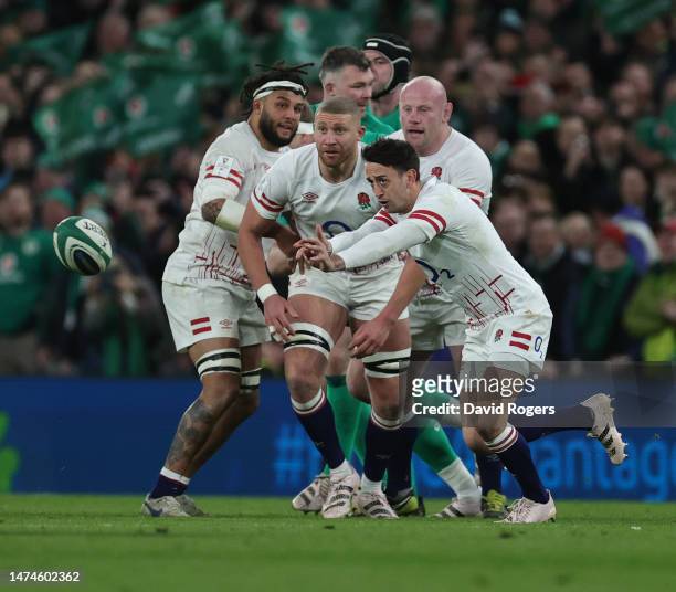 Alex Mitchell of England passes the ball during the Six Nations Rugby match between Ireland and England at Aviva Stadium on March 18, 2023 in Dublin,...