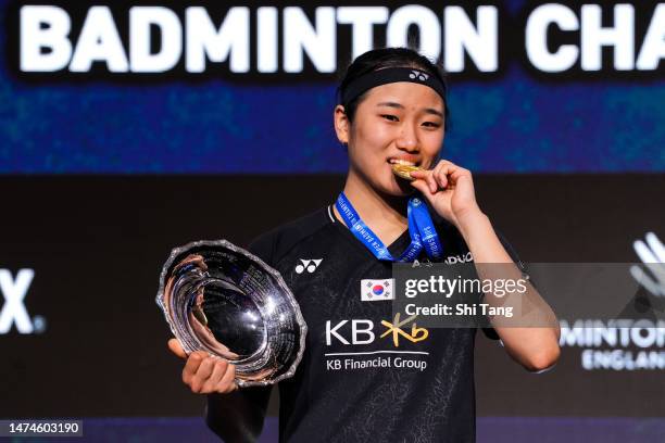 An Se Young of Korea kisses her medal on the podium after the Women's Single Final match against Chen Yufei of China on day six of the Yonex All...