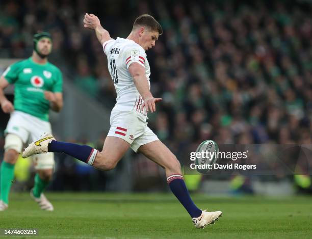 Owen Farrell of England kicks the ball upfield during the Six Nations Rugby match between Ireland and England at Aviva Stadium on March 18, 2023 in...