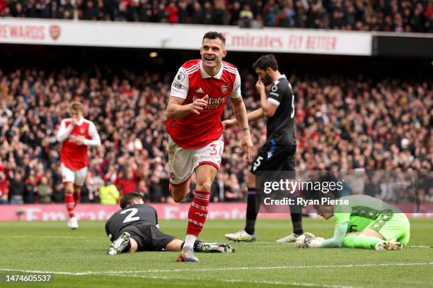 Granit Xhaka of Arsenal celebrates after scoring the team's third goal during the Premier League match between Arsenal FC and Crystal Palace at...