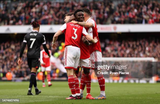 Bukayo Saka of Arsenal celebrates after scoring the team's fourth goal with teammates during the Premier League match between Arsenal FC and Crystal...