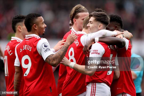 Bukayo Saka of Arsenal celebrates after scoring the team's fourth goal with teammates during the Premier League match between Arsenal FC and Crystal...