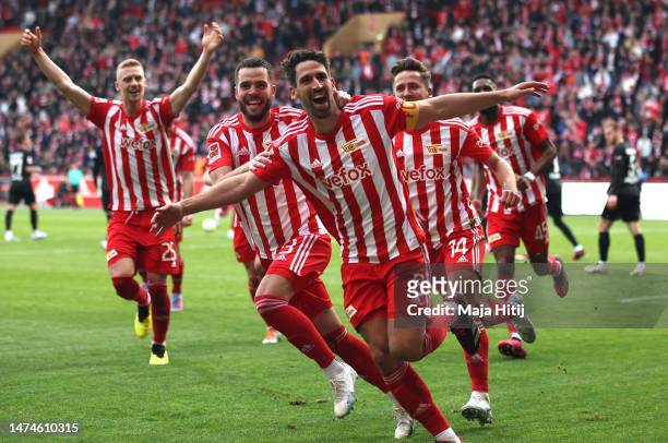 Rani Khedira of 1.FC Union Berlin celebrates with teammates after scoring the team's first goal during the Bundesliga match between 1. FC Union...