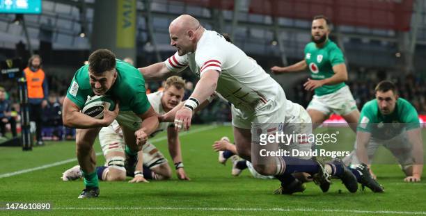Dan Sheehan of Ireland dives past Dan Cole to score his second and Ireland's third try during the Six Nations Rugby match between Ireland and England...
