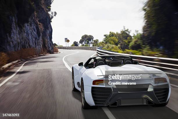 sports car on a coastal road - luxury car 個照片及圖片檔