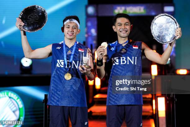 Fajar Alfian and Muhammad Rian Ardianto of Indonesia pose with their trophies on the podium after the Men's Double Final match against Mohammad Ahsan...