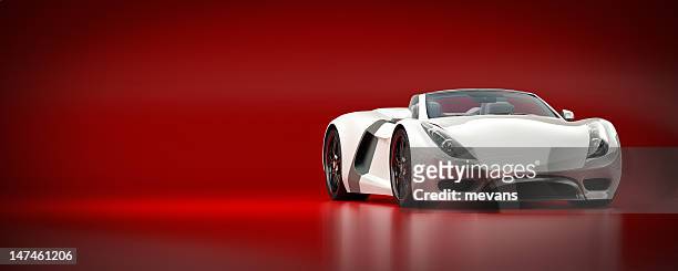 white sports car on a red background - prestige car stock pictures, royalty-free photos & images