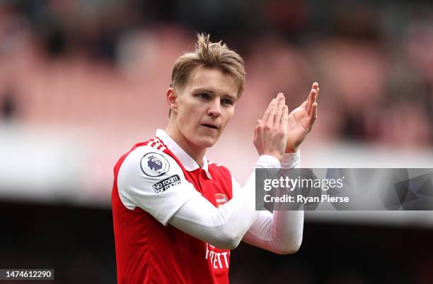 Martin Odegaard of Arsenal applauds their fans after the Premier League match between Arsenal FC and Crystal Palace at Emirates Stadium on March 19,...