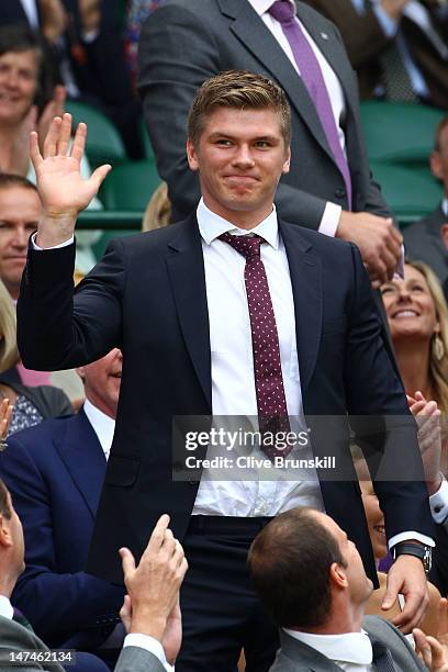 Rugby player Owen Farrell attends the Ladies' Singles third round match Serena Williams of the USA and Jie Zheng of China on day six of the Wimbledon...