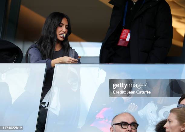 Kim Kardashian prepares a lollipop for her son during the Ligue 1 Uber Eats match between Paris Saint-Germain and Stade Rennais at Parc des Princes...