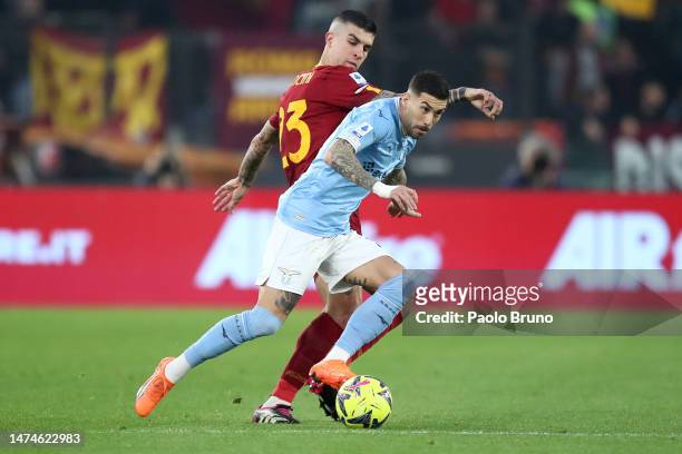 Gianluca Mancini of AS Roma and Mattia Zaccagni of SS Lazio battle for the ball during the Serie A match between SS Lazio and AS Roma at Stadio...