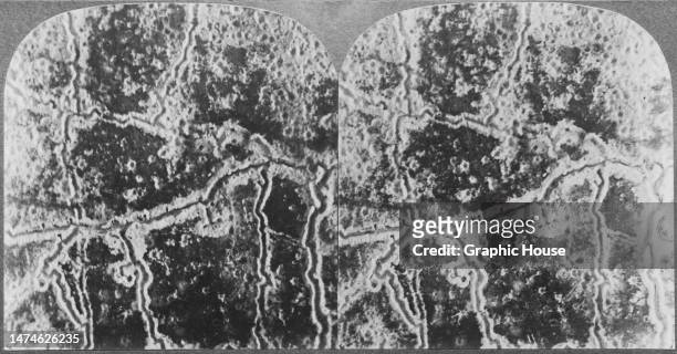 Stereoscopic image showing an aerial view of trenches and damage caused by shelling on the Western Front during the First World War, France, circa...