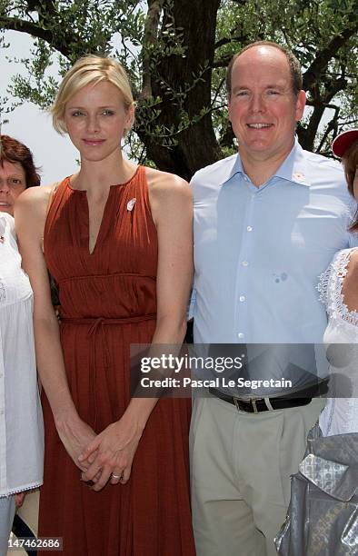 Prince Albert II of Monaco and Princess Charlene attend the annual Monaco Red Cross Pique-Nique at Jardins Princesse Antoinette on June 30, 2012 in...