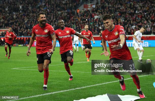 Exequiel Palacios of Bayer 04 Leverkusen celebrates with teammates after scoring the team's second goal during the Bundesliga match between Bayer 04...