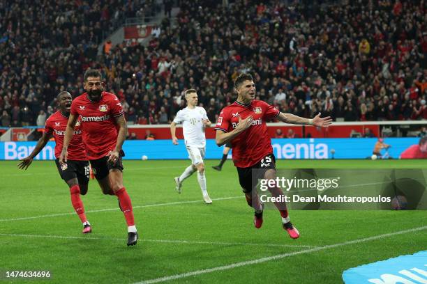Exequiel Palacios of Bayer 04 Leverkusen celebrates with teammates after scoring the team's second goal during the Bundesliga match between Bayer 04...