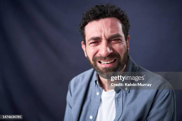 portrait of crying mature man - frowning stock pictures, royalty-free photos & images