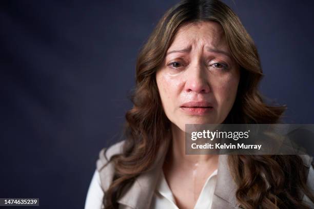 portrait of anxious crying mature woman - frowning face stock pictures, royalty-free photos & images