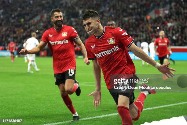 Exequiel Palacios of Bayer 04 Leverkusen celebrates with teammates after scoring the team's second goal during the Bundesliga match between Bayer 04...