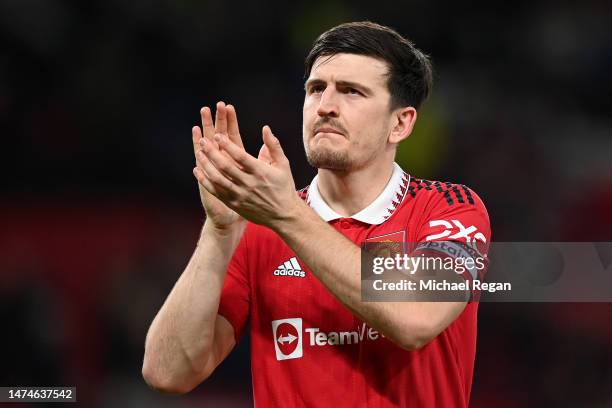 Harry Maguire of Manchester United applauds the fans after their victory in the Emirates FA Cup Quarter Final match between Manchester United and...