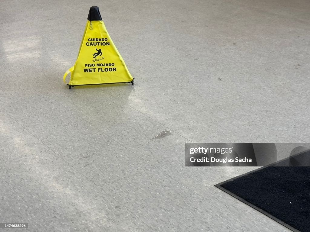 Spill warning safety cone on the floor