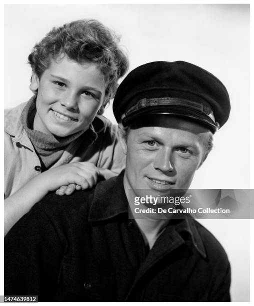 Publicity portrait of child actor Dean Stockwell and actor Richard Widmark in the film 'Down to the Sea in Ships' United States.