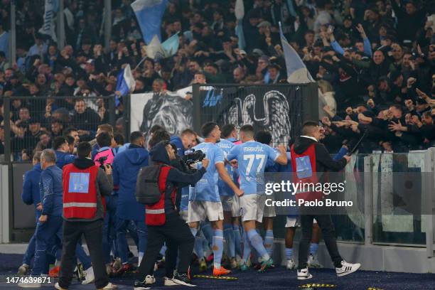 Mattia Zaccagni of SS Lazio celebrates with fans after scoring the team's first goal during the Serie A match between SS Lazio and AS Roma at Stadio...