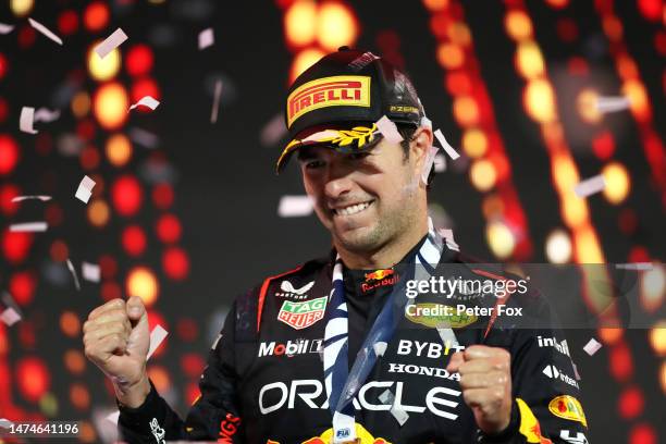 Race winner Sergio Perez of Mexico and Oracle Red Bull Racing celebrates on the podium during the F1 Grand Prix of Saudi Arabia at Jeddah Corniche...