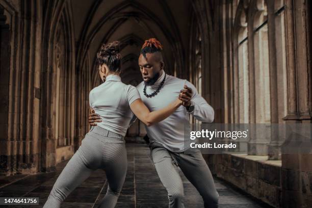 urban mixed race couple dancing in classical public place - utrecht stockfoto's en -beelden