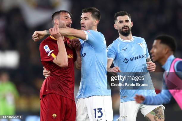 Bryan Cristante of AS Roma clashes with Alessio Romagnoli of SS Lazio during the Serie A match between SS Lazio and AS Roma at Stadio Olimpico on...