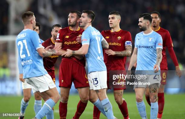 Bryan Cristante of AS Roma clashes with Alessio Romagnoli of SS Lazio during the Serie A match between SS Lazio and AS Roma at Stadio Olimpico on...