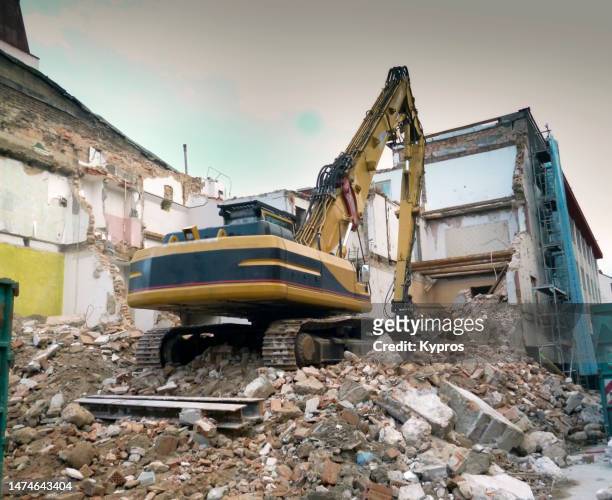 backhoe, construction machinery - heavy demolition stock-fotos und bilder