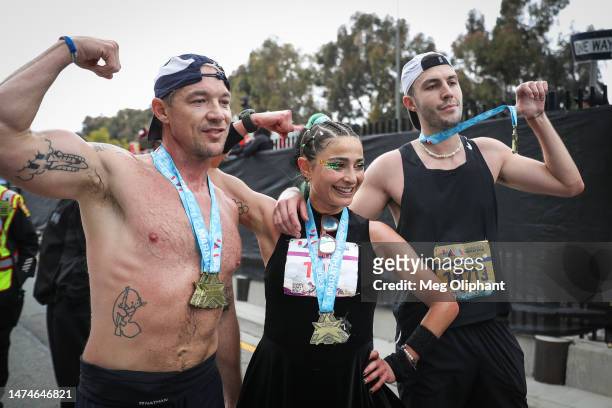 Diplo, Alexi Pappas, and Cloonee pose for photos after finishing the Los Angeles Marathon on March 19, 2023 in Los Angeles, California.