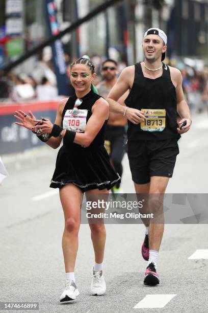 Alexi Pappas finishes the Los Angeles Marathon with Cloonee on March 19, 2023 in Los Angeles, California.