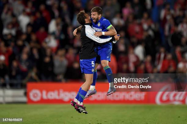 Portu of Getafe CF celebrates with teammate Luis Milla after scoring the team's second goal during the LaLiga Santander match between Getafe CF and...