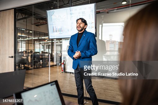 Mature businessman making a presentation in the meeting room