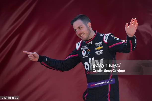 Alex Bowman, driver of the Ally Chevrolet, walks onstage during driver intros prior to the NASCAR Cup Series Ambetter Health 400 at Atlanta Motor...