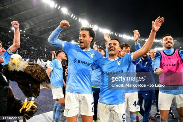 Felipe Anderson and Pedro Rodriguez of SS Lazio celebrates a victory after the Serie A match between SS Lazio and AS Roma at Stadio Olimpico on March...