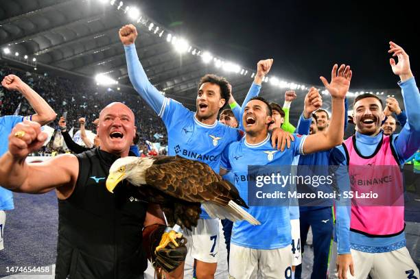 Felipe Anderson and Pedro Rodriguez of SS Lazio celebrates a victory after the Serie A match between SS Lazio and AS Roma at Stadio Olimpico on March...