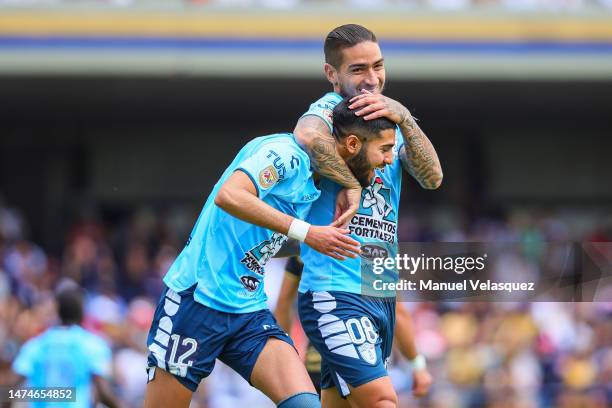 Mauricio Isais of Pachuca celebrates with Cristian Arango of Pachuca after scoring the team's second goal during the 12th round match between Pumas...