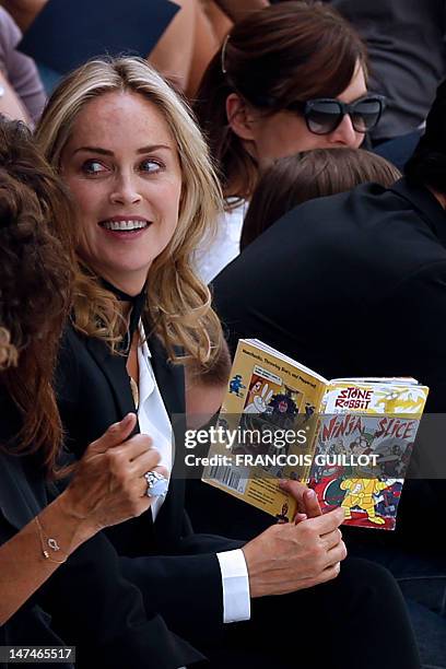 Actress Sharon Stone attends the men's spring-summer 2013 fashion collection show of Belgian designer Kris Van Assche for the label Dior, on June 30,...