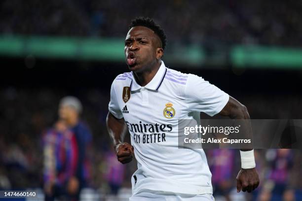 Vinicius Junior of Real Madrid celebrates their side's first goal, an own goal by Ronald Araujo of FC Barcelona during the LaLiga Santander match...