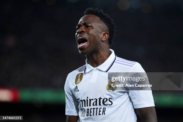 Vinicius Junior of Real Madrid celebrates their side's first goal, an own goal by Ronald Araujo of FC Barcelona during the LaLiga Santander match...