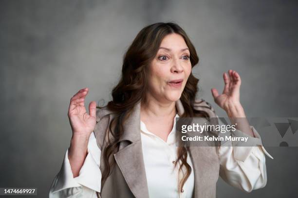 portrait of surprised mature woman - women laughing stock pictures, royalty-free photos & images